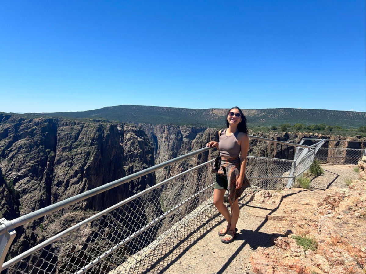 Author Abigail standing at a lookout in Black Canyon of the Gunnison