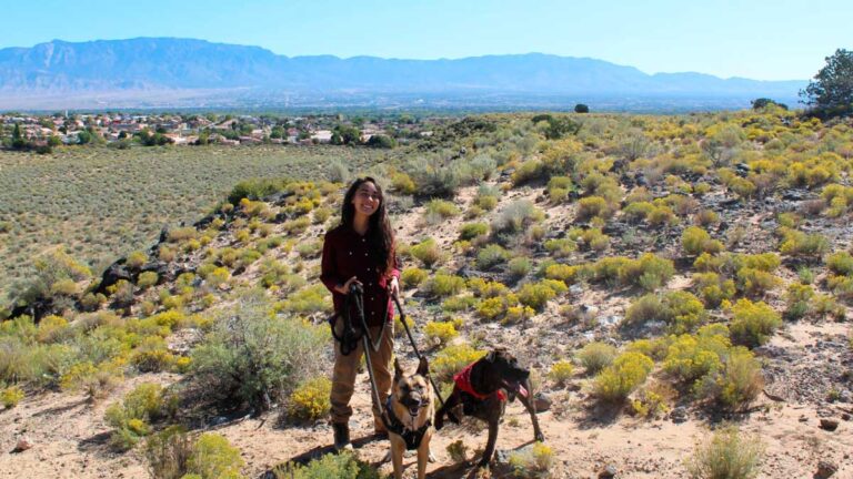 The author Abigail with her dogs at the Petroglyph National Monument