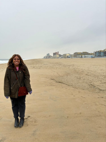 Author Alexandria standing on the beach at Ocean City