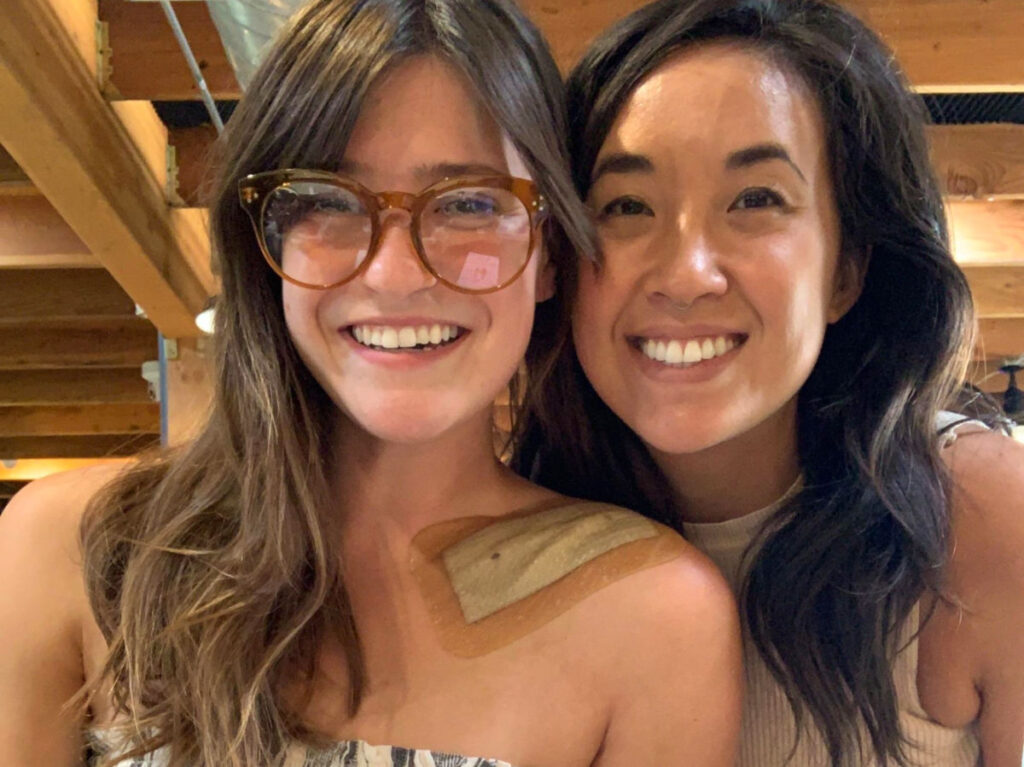 Author Betty with a patch on her shoulder while meeting friends
