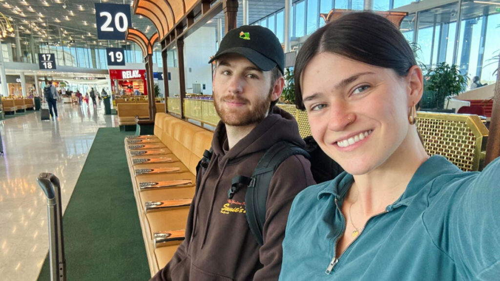 Author Betty and her boyfriend taking a selfie at the airport