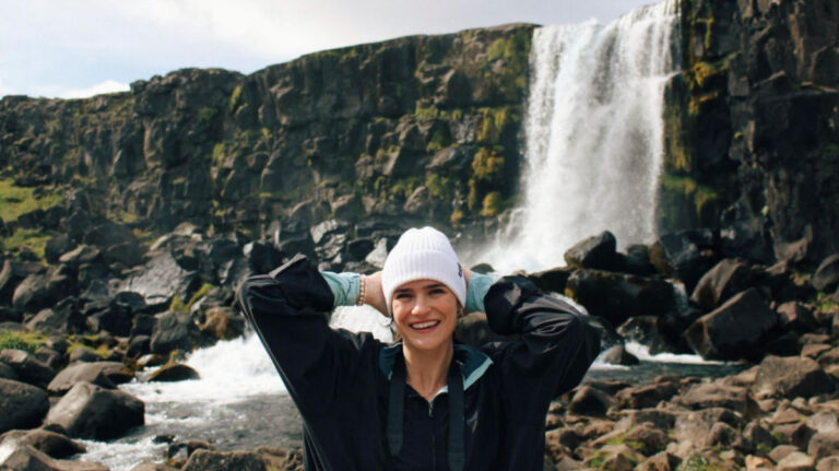 Travel Lemming Author Betty posing for a photo near the Gullfoss Waterfall