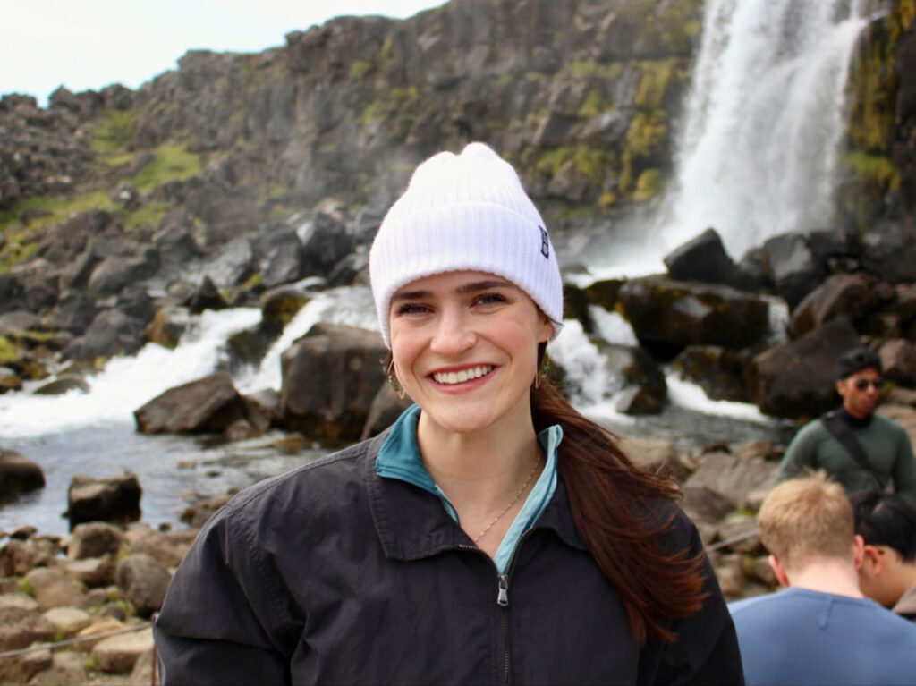 Author Betty standing at Öxarárfoss waterfall