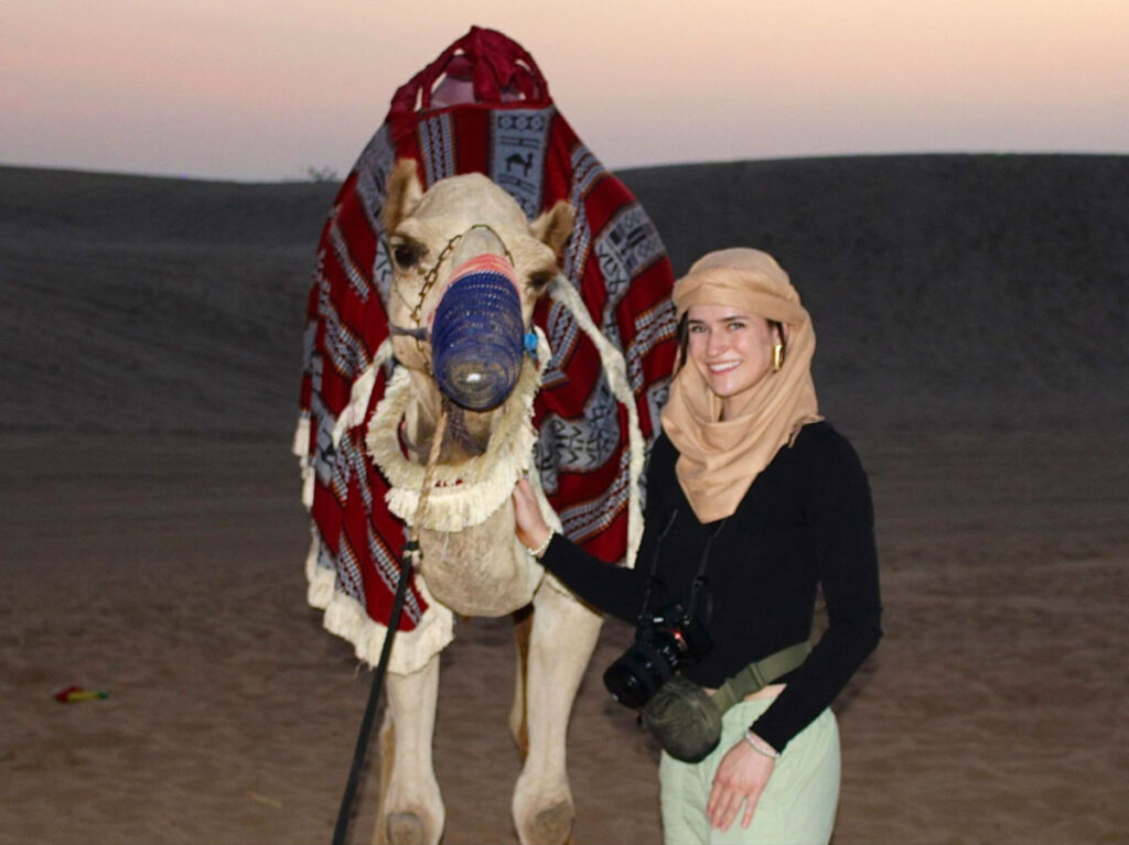 Author Betty posing for a photo with a Camel