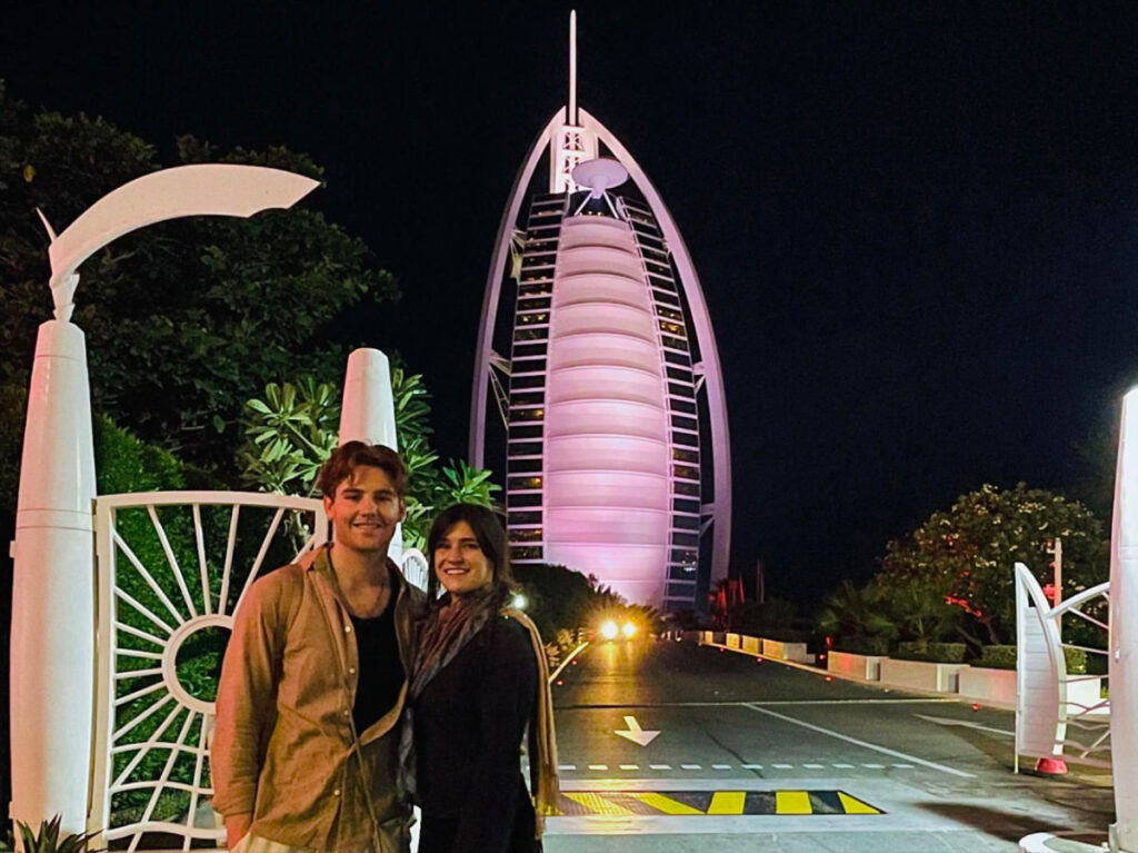 Author Betty and her boyfriend taking a photo with the Burj Al Arab
