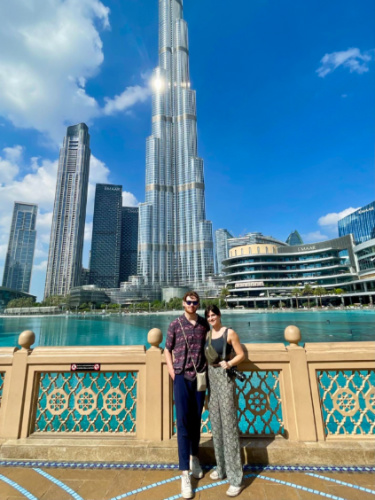 Author Betty and her boyfriend taking a photo with the Burj Khalifa