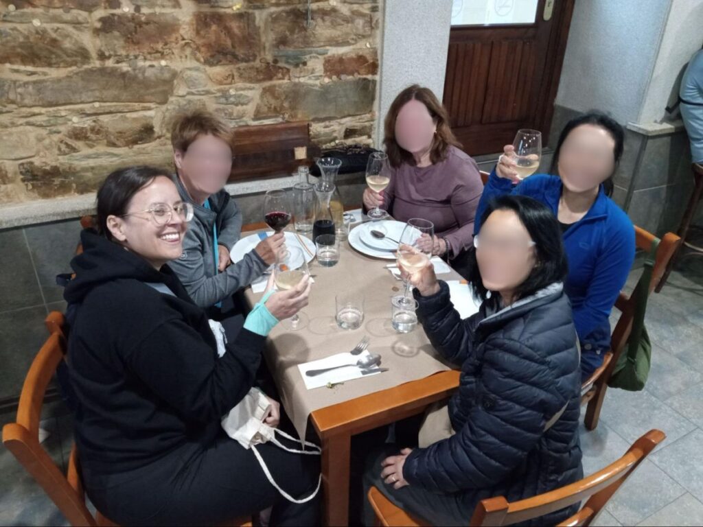 Author Catherine enjoying her wine with other guests