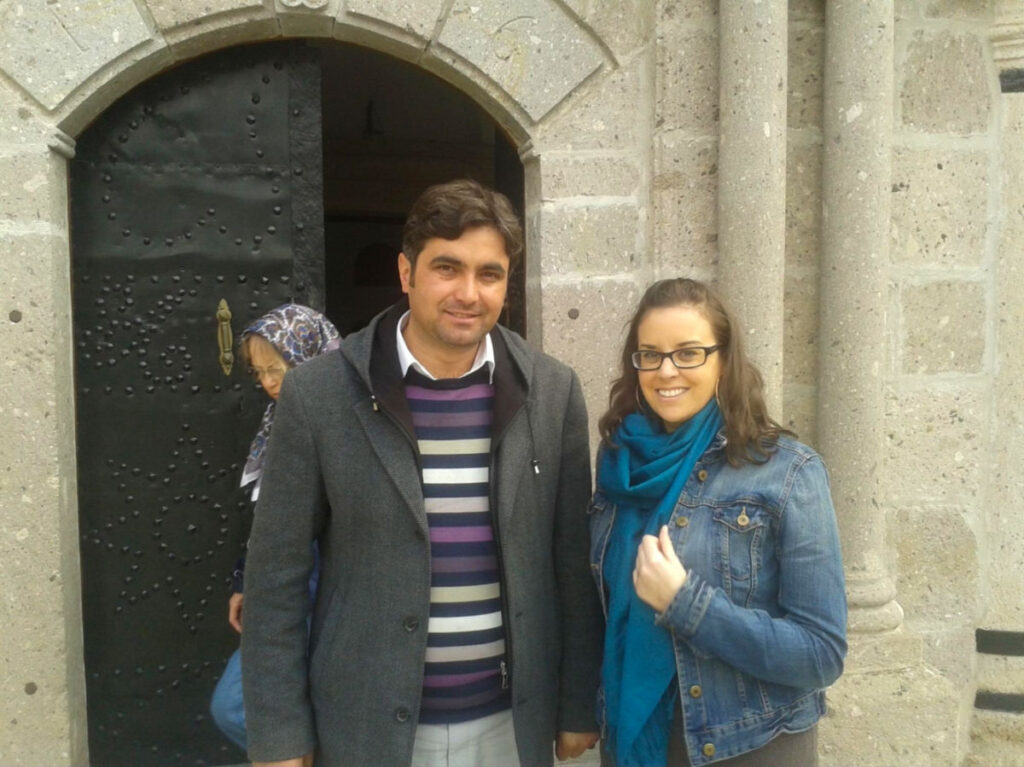 Author Catherine taking a photo with a Turkish Imam