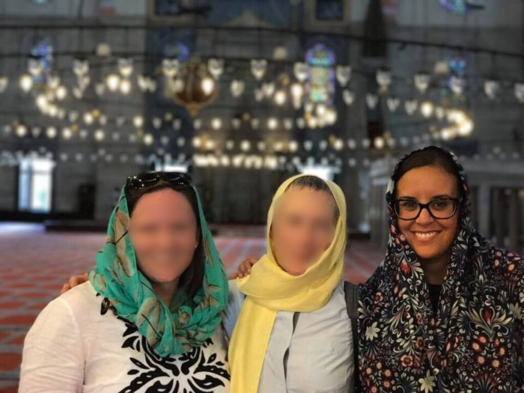 Author Catherine taking a photo with her roommates