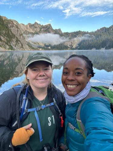 Author Chelsea with her buddy smiling for a selfie during their hike