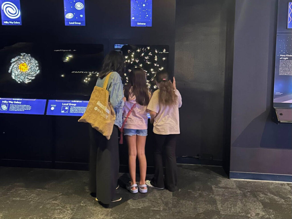 Author Claudicet with her daughter and her friend at the Museum of Science