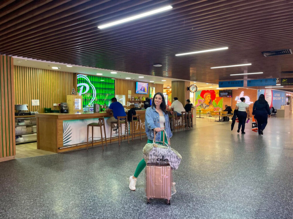 Author Claudicet with her luggage at the airport
