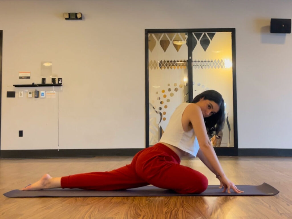 Author Claudicet doing yoga in a studio