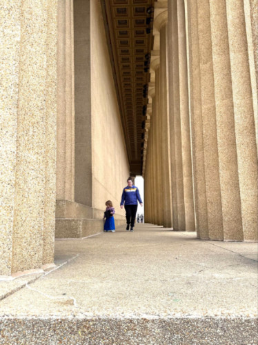 Author Elizabeth and her daughter walking among the columns of the Parthenon