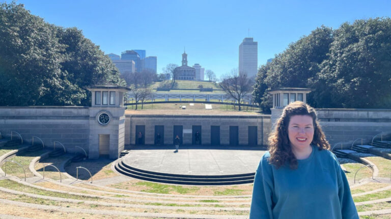 Author Elizabeth standing at the amphitheater at the Bicentennial Capitol Mall State Park