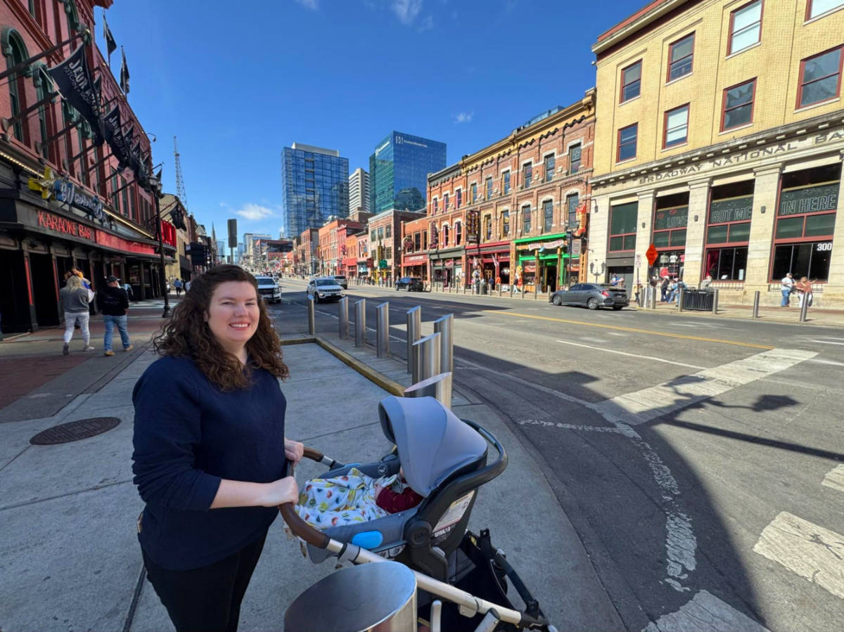 Author Elizabeth with her baby strolling in Downtown Nashville