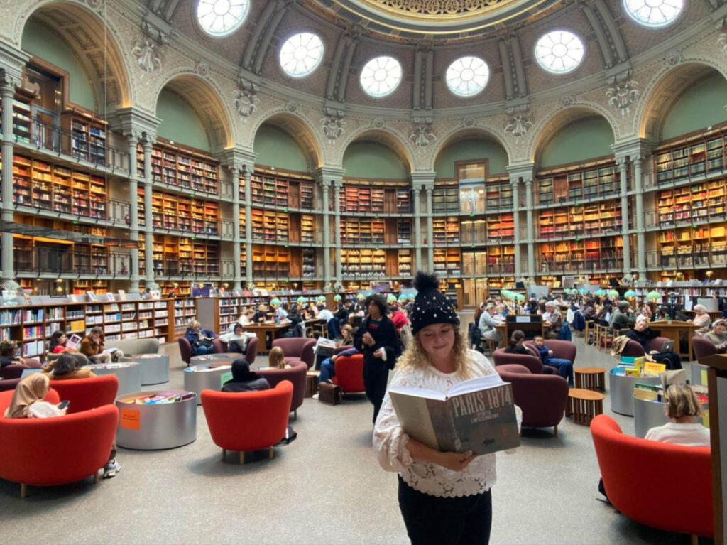 Author Jess reading a book at The National Library of France