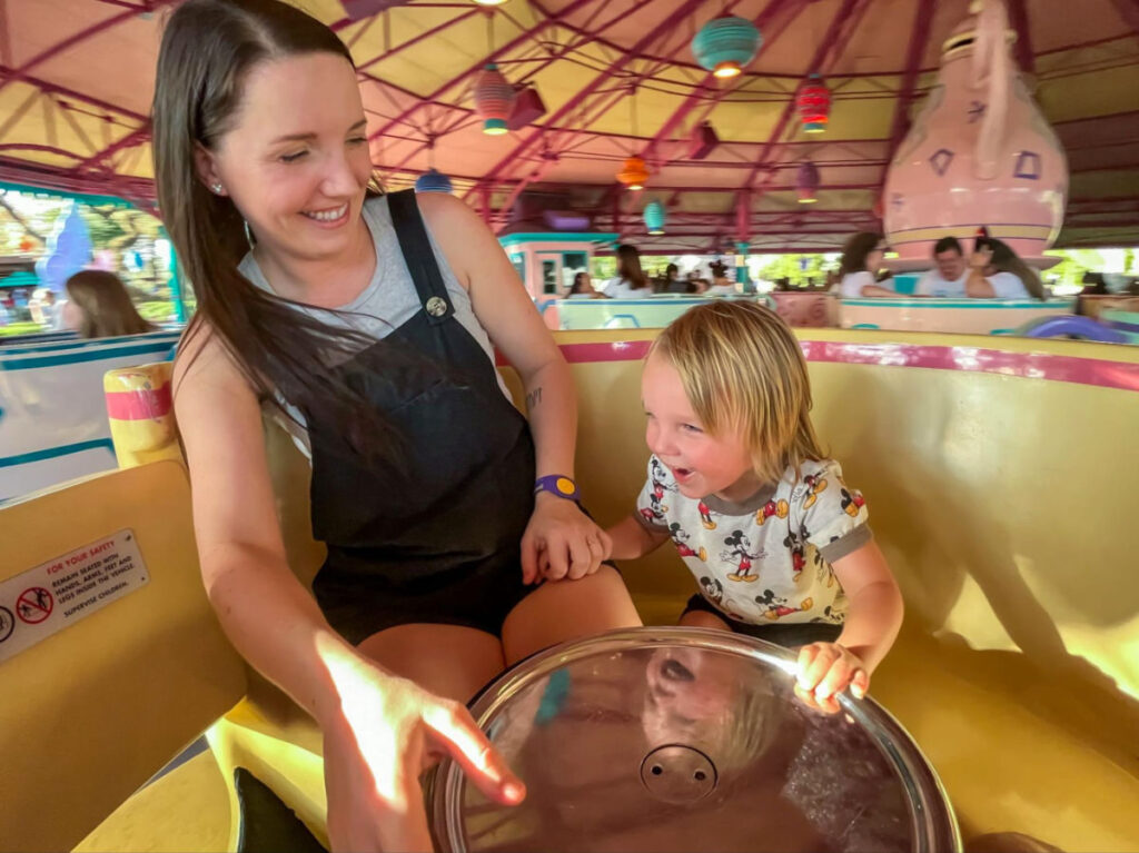 Author Katie and her son enjoying the Mad Tea party ride