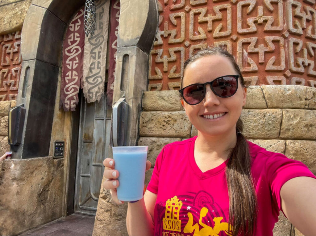 Travel Lemming Author Katie enjoying a blue milk at Hollywood Studios