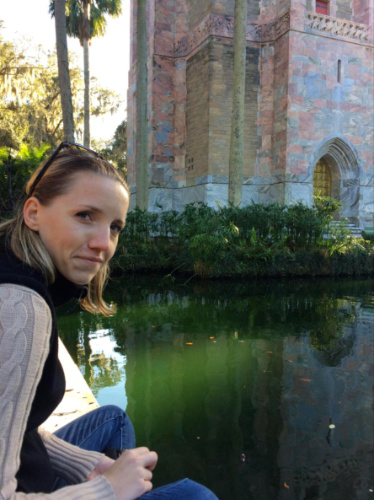 Author Katie feeding the koi fish in front of Bok Tower Gardens