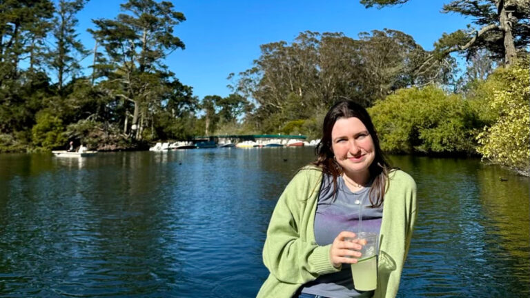 Author Laura sitting in a rowboat on Blue Heron Lake in Golden Gate Park