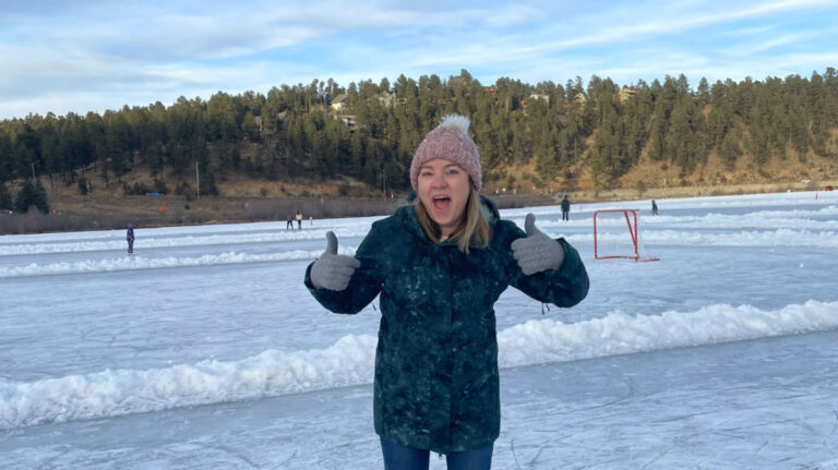 Author Laura giving the thumbs up at Evergreen Lake