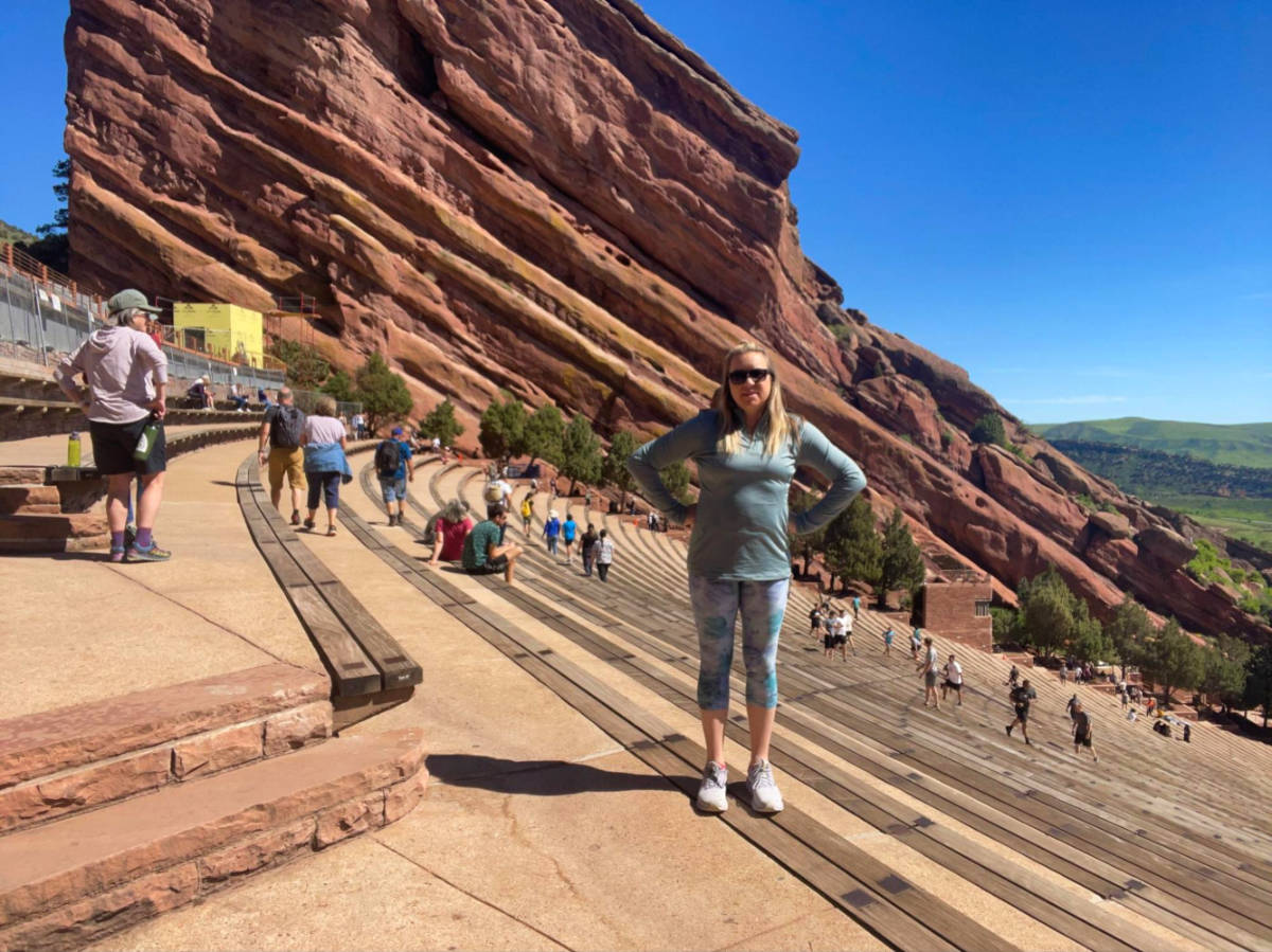 Author Laura standing at Red Rocks Park & Amphitheatre
