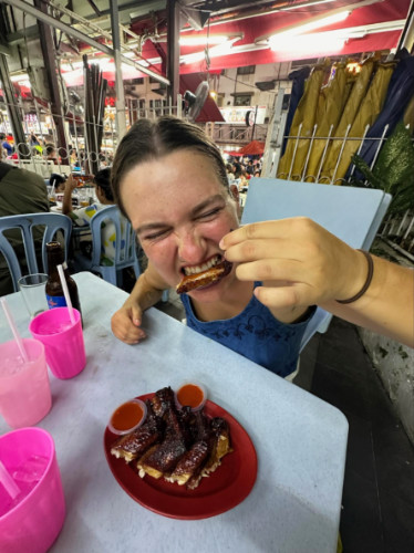 Author Laura chowing down on barbecue chicken wings