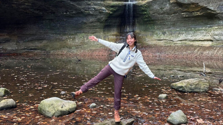 Author Lea Rose standing on a rock at Matthiessen State Park