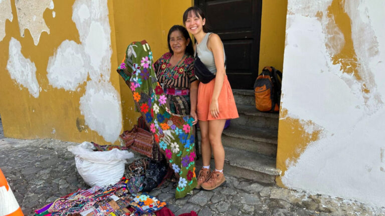 Author Lea Rose with a local artisan in Antigua