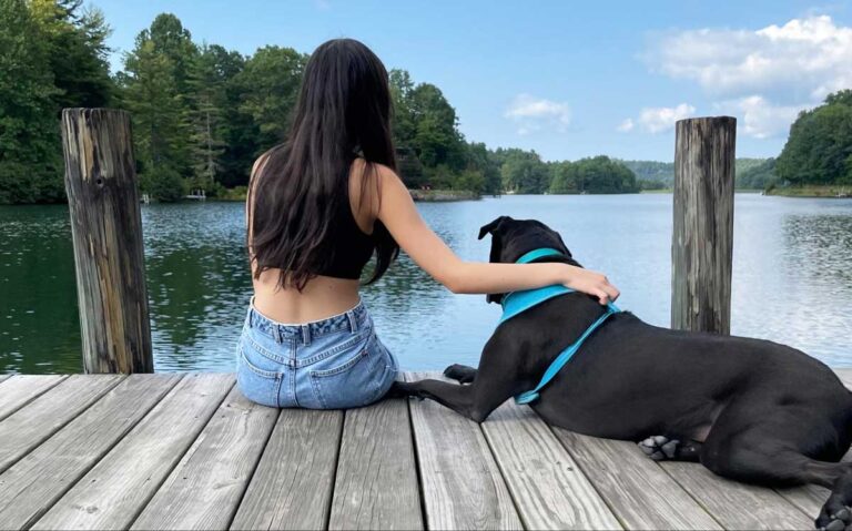 The author Lea Rose Allbaugh admiring the nature with her dog