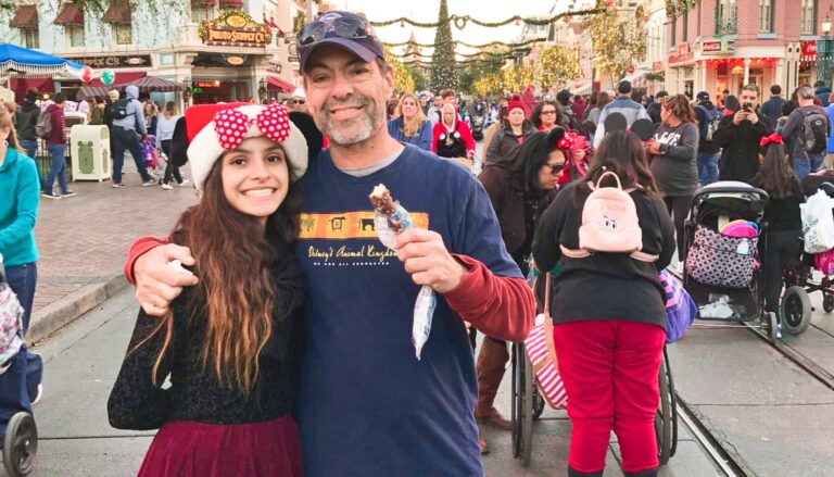 The author McKenna Mobley and her father holding an ice cream at Disneyland