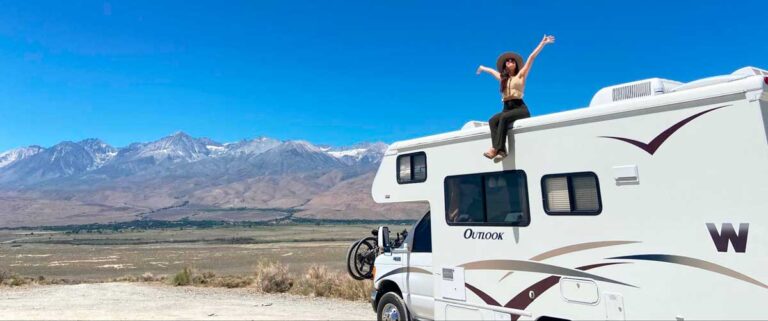 Author McKenna poses on the roof of an RV