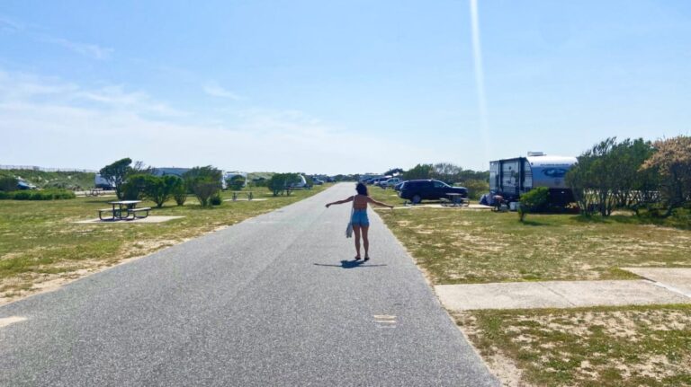 The author McKenna Mobley, posing in the middle of the empty road at Hither Hills State Park Campground