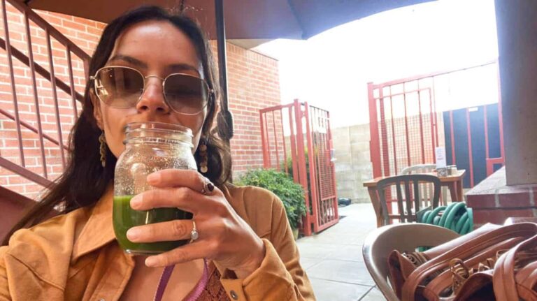 The author, McKenna, drinking the “Hale the Kale” green juice at Rutabegorz in Fullerton