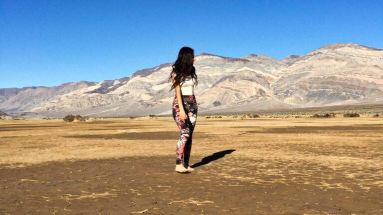 The author McKenna Mobley, standing barefoot on the Badwater Basin salt flats
