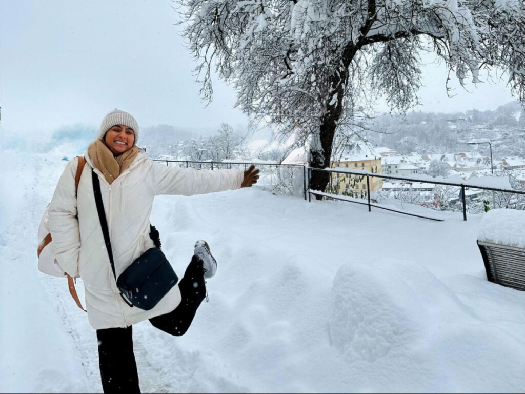 Author Meera enjoying the snow in Prague