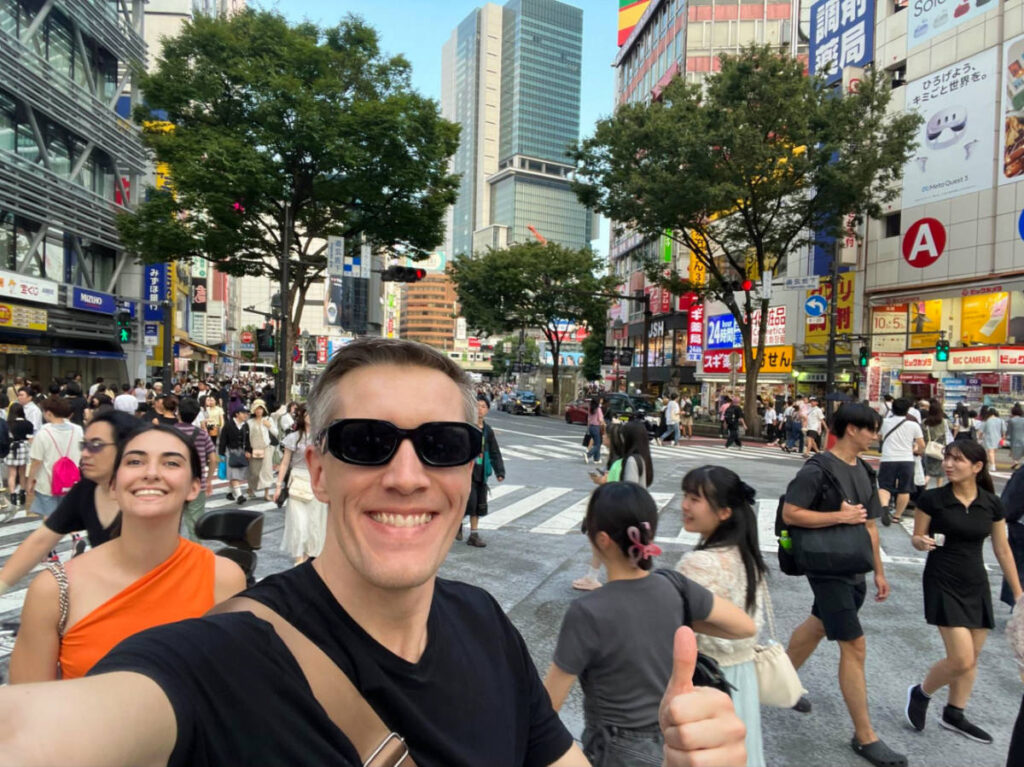 Author Nate and Clara taking a selfie at the Shibuya crossing