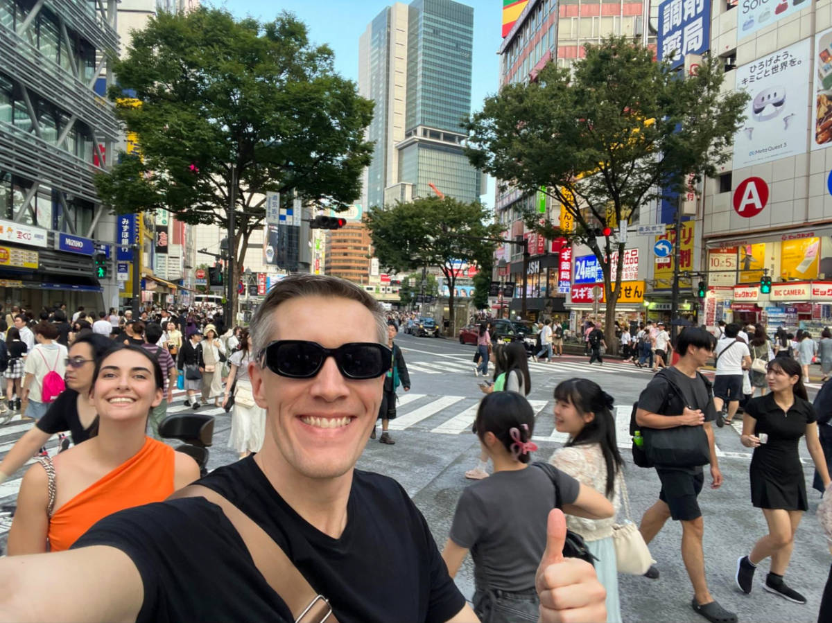 Author Nate and Clara taking a selfie at the Shibuya crossing