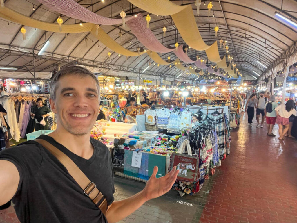 Author Nate showing the shops at Anusaran Market