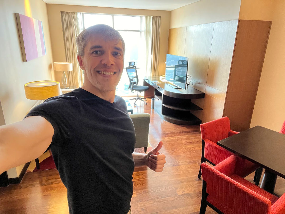 Author Nate taking a selfie at a room in Sathorn Vista Executive Apartments