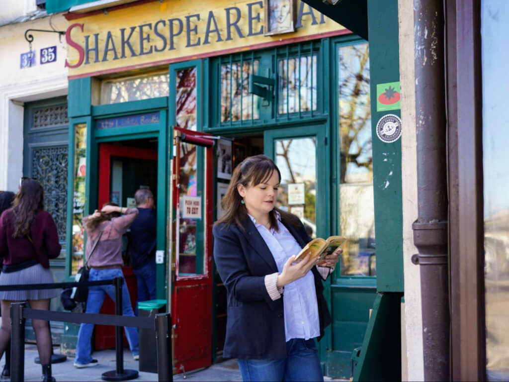 Author Rachel reading a book outside Shakespeare & Company