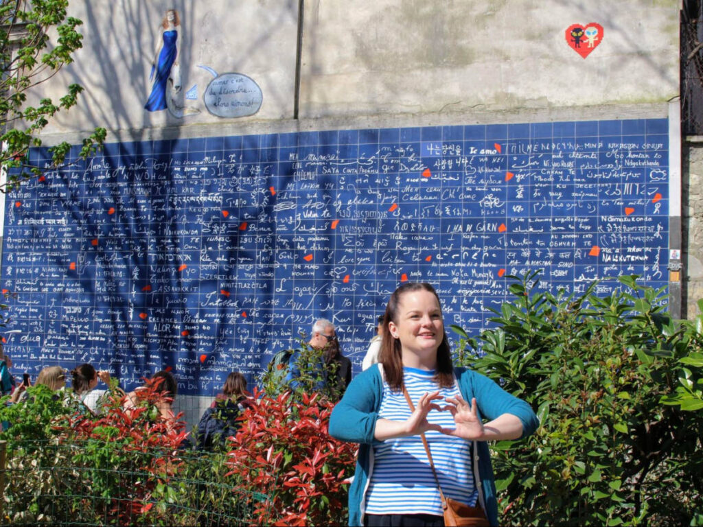 Author Rachel sporting a heart sign at the Wall of Love