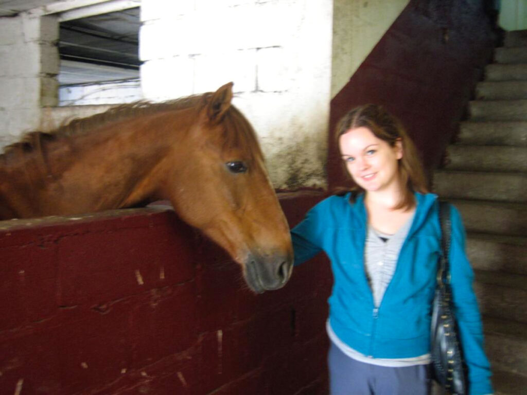 Author Rachel visiting a horse at the Bois de Vincennes