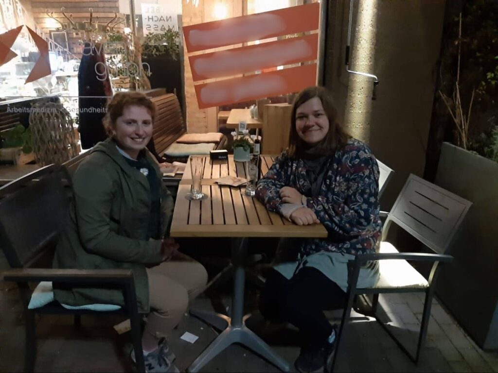 Author Ruthie and her close friend enjoying a drink in Dortmund