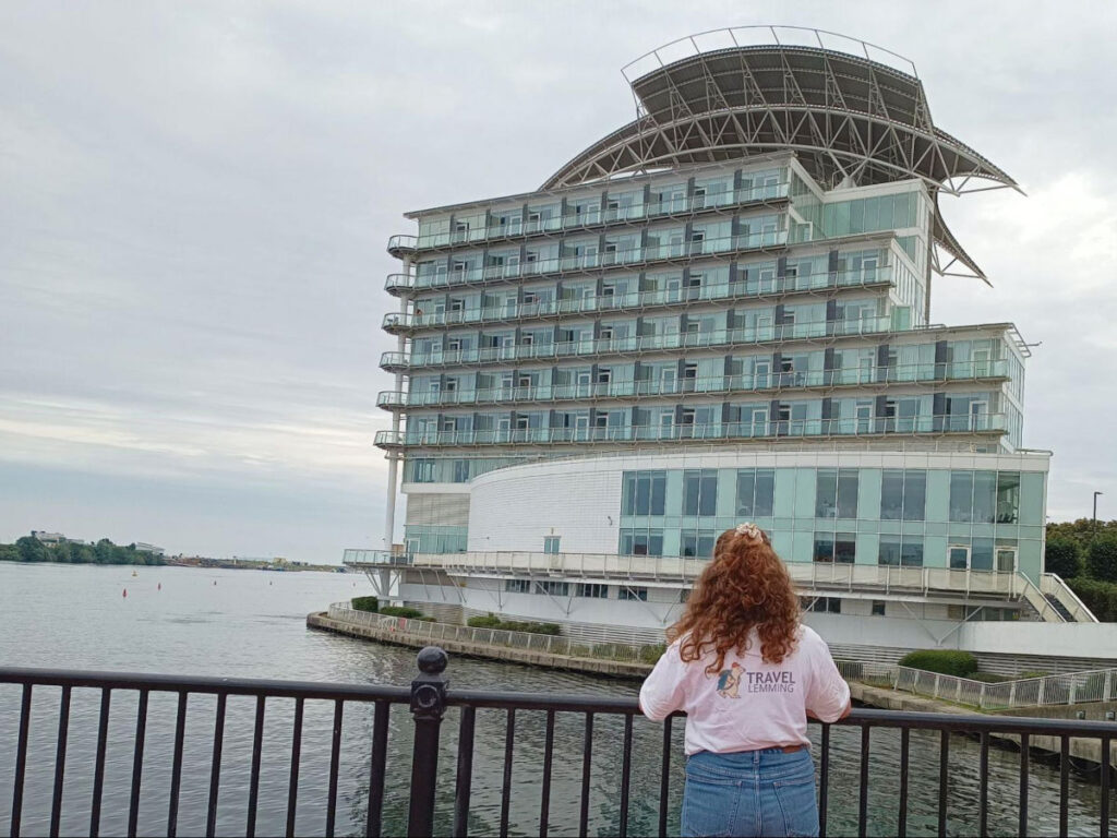 Author Ruthie wearing a Travel Lemming t-shirt while looking at voco St. David's Cardiff