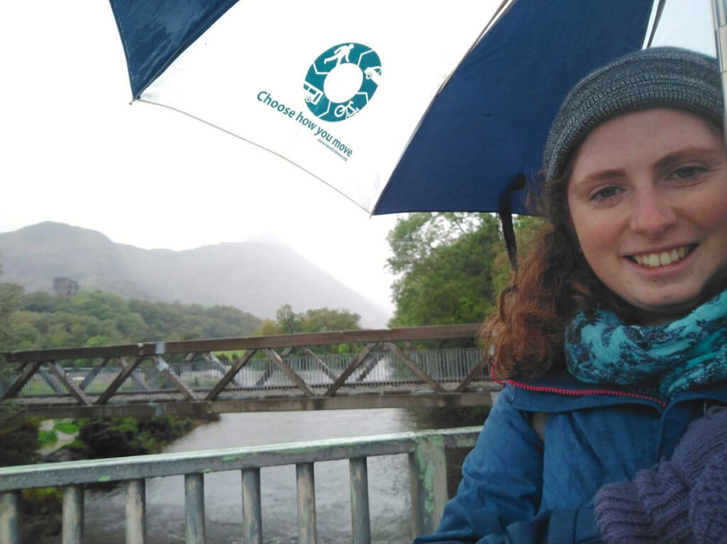 Author Ruthie holding an umbrella in Llanberis