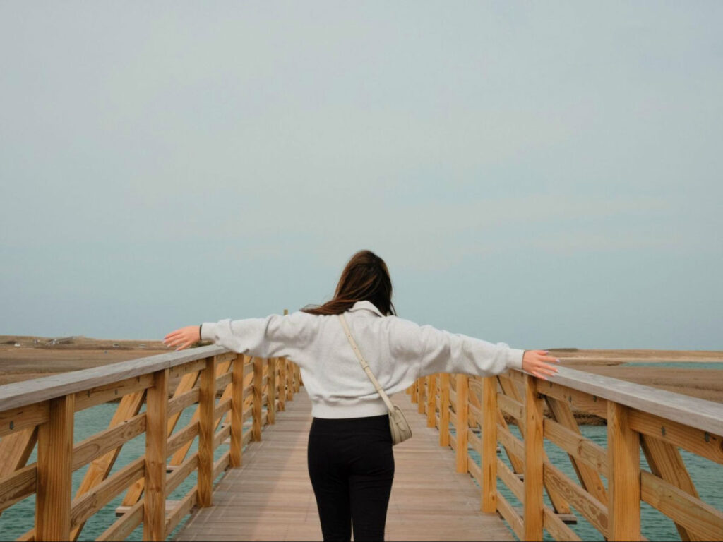 Author Samantha walking along the Sandwich Boardwalk