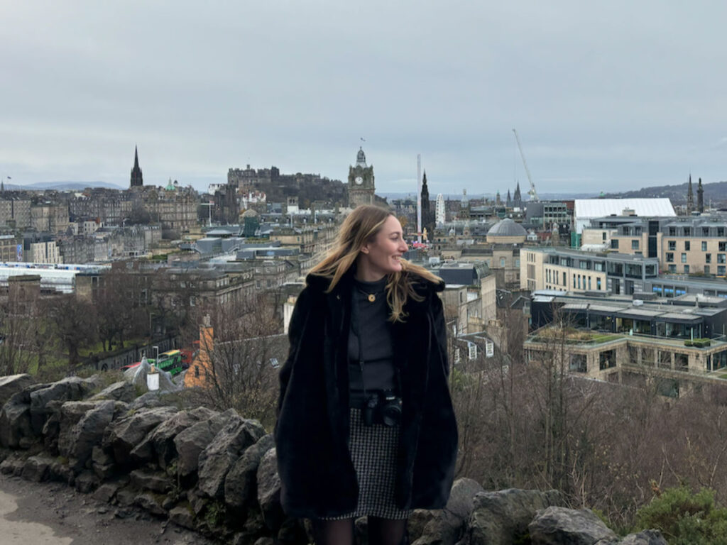 Author Sky smiling brightly at Calton Hill n Edinburgh