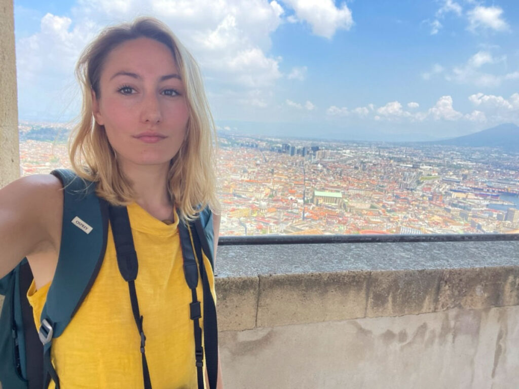 Author Sky taking a selfie with a view of the city